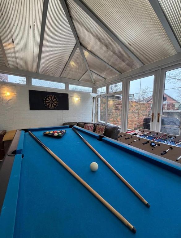 a billiard room with a blue pool table at Rotherham Meadowhall in Rotherham