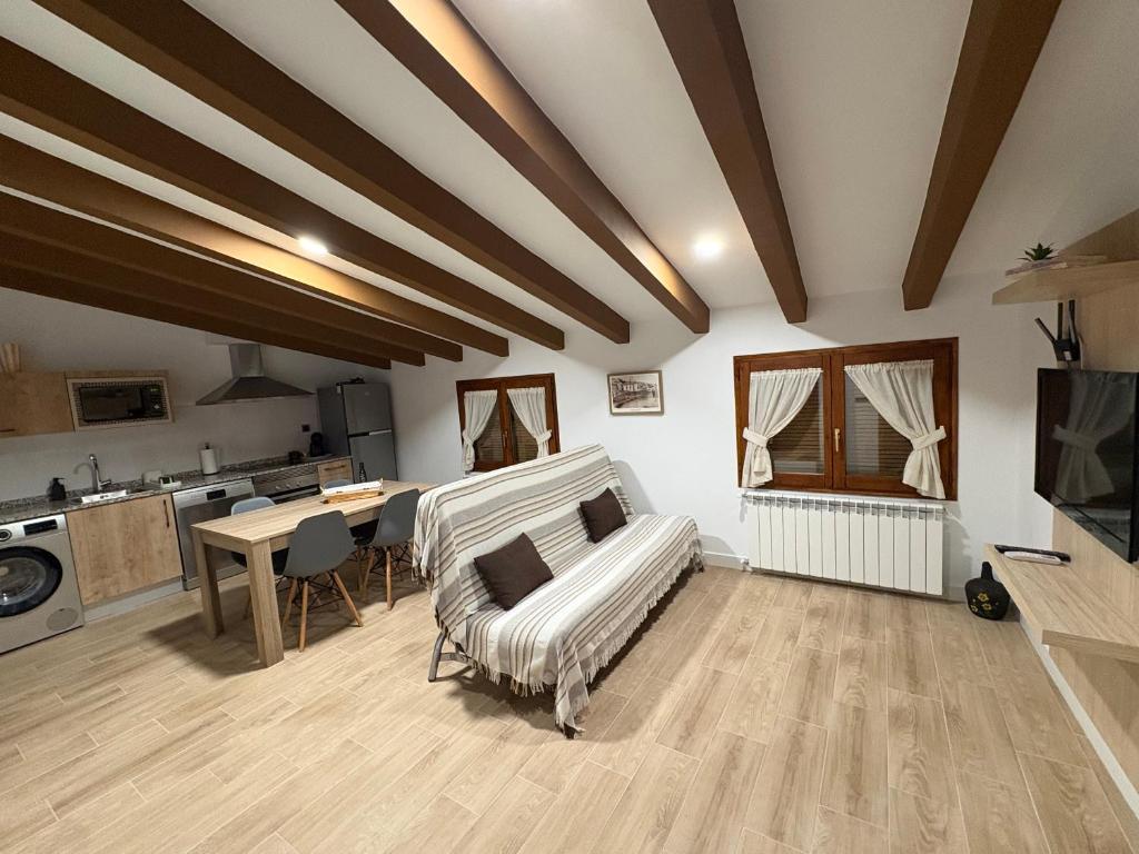 a living room with a couch and a table at Apartamentos Rurales Miguela in Calaceite