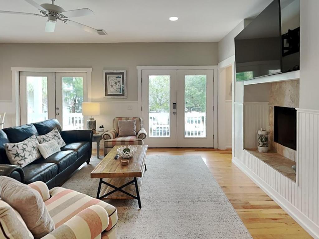 a living room with a couch and a table at Billfish in Tybee Island