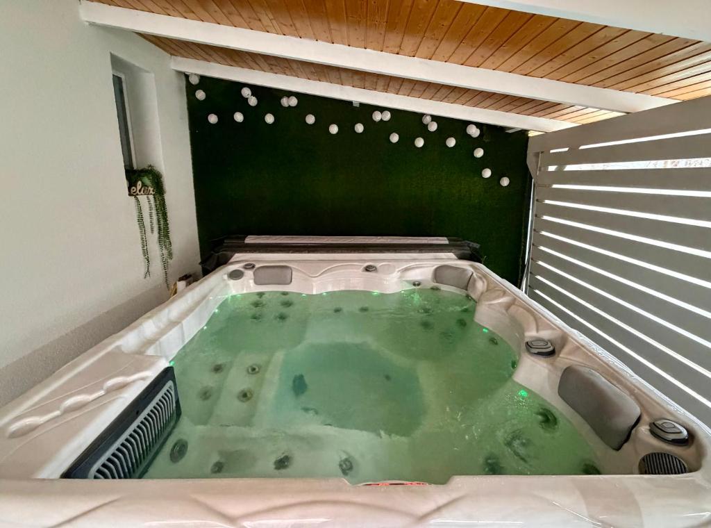 a jacuzzi tub in the corner of a room at Avar Inn in Tiszalök