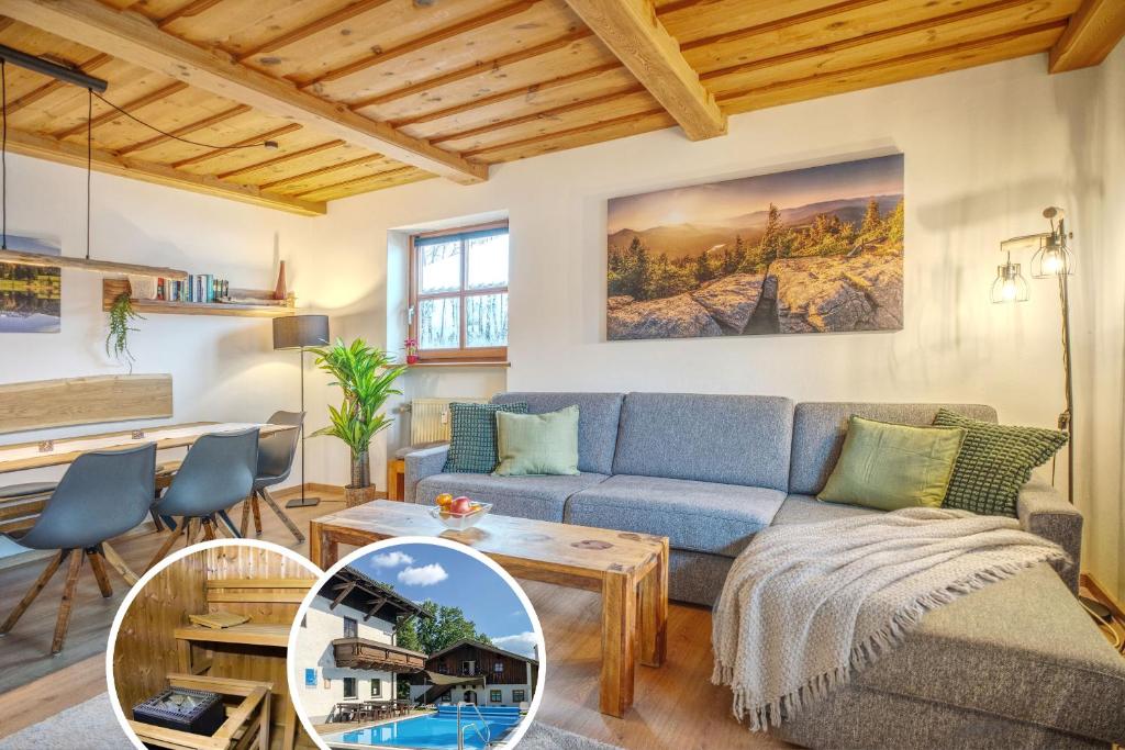 a living room with a couch and a table at Ferienwohnung Hauzenberg mit Pool & Sauna in Hauzenberg