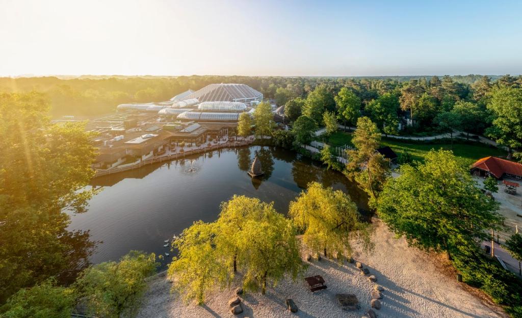 an overhead view of a lake with a resort at Center Parcs Apartments Erperheide in Peer