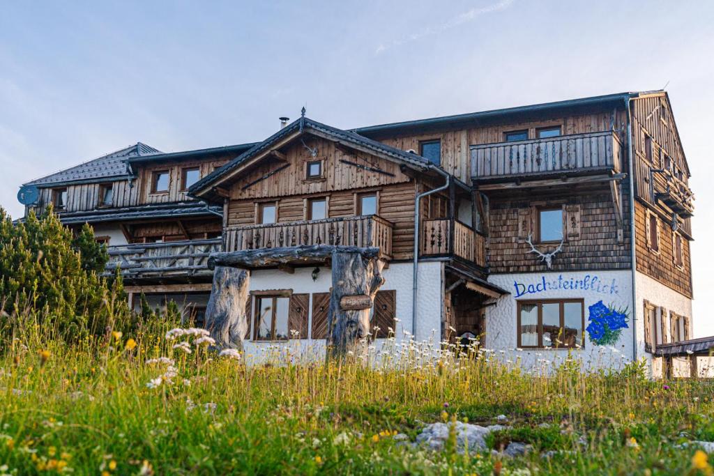 a large wooden house with at Almhaus Dachsteinblick am Feuerkogel in Ebensee