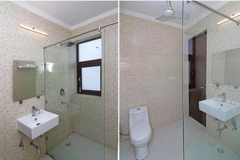 two pictures of a bathroom with a toilet and a sink at The hotel am bliss in Gurgaon