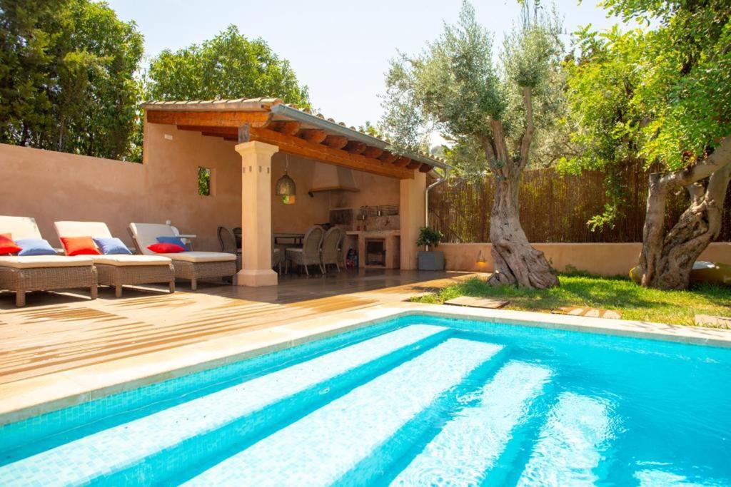 a swimming pool in a yard with a house at Mallorca Soller Port Villa High end Balearics in Port de Soller