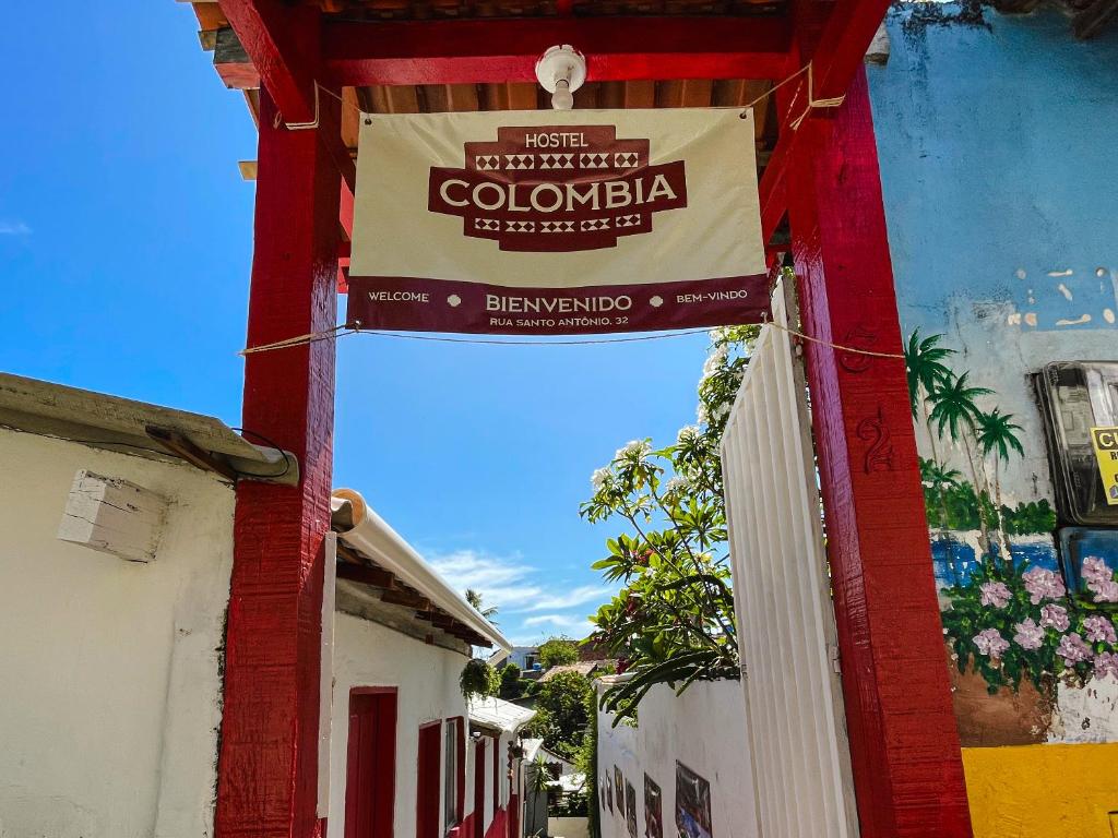 a sign that reads colombia on the side of a building at Colombia Hostel in Porto Seguro