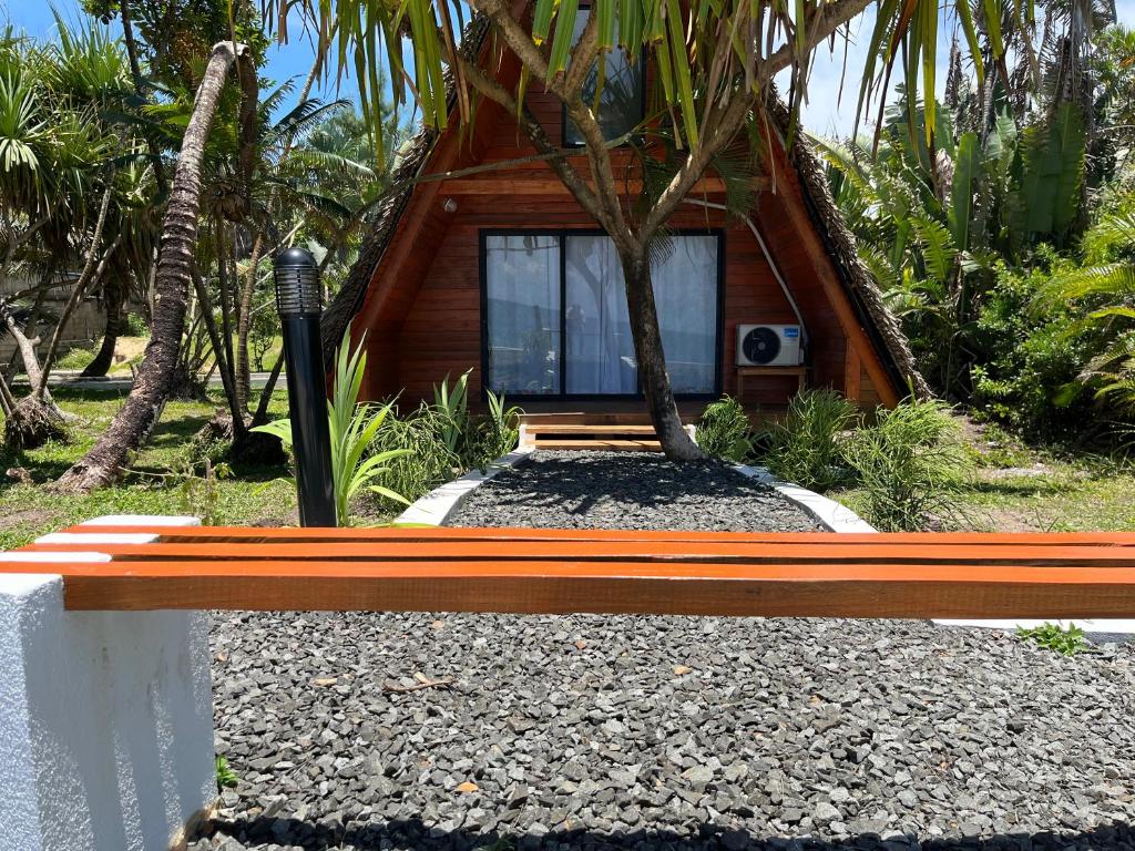a small house with a tree in front of it at Le ZANATANY BEACH in Tamatave