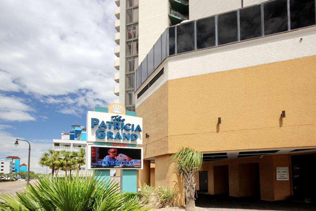 a building with a sign for a parking garage at The Patricia Grand in Myrtle Beach