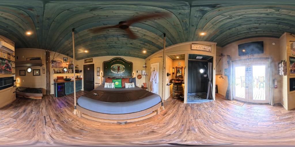 a large room with a ceiling with a wooden floor at "The 19th Hole" Luxury Treehouse w Golf Views & Private 20ft Slide - 10 Miles from Dollywood in Sevierville