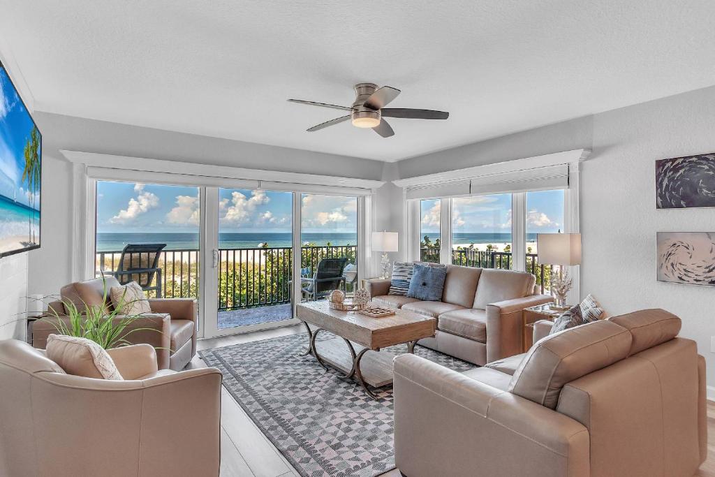 a living room with a couch and chairs at 201 Surfside in Clearwater Beach