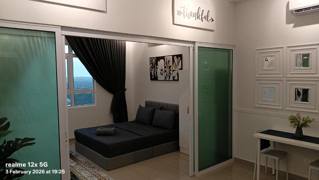 a living room with a couch and a window at Mesahill Premier Suite-Wi-Fi-NETFLIX in Nilai