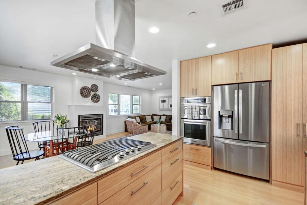 a kitchen with stainless steel appliances and a living room at Perfect Friends Getaway in Sonoma in Sonoma
