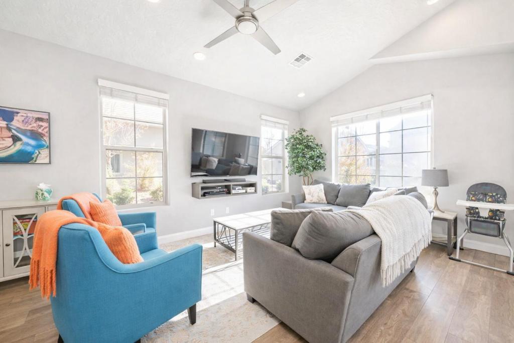 a living room with a couch and a chair at Adventures Base! Family Friendly w heated community pool in Washington