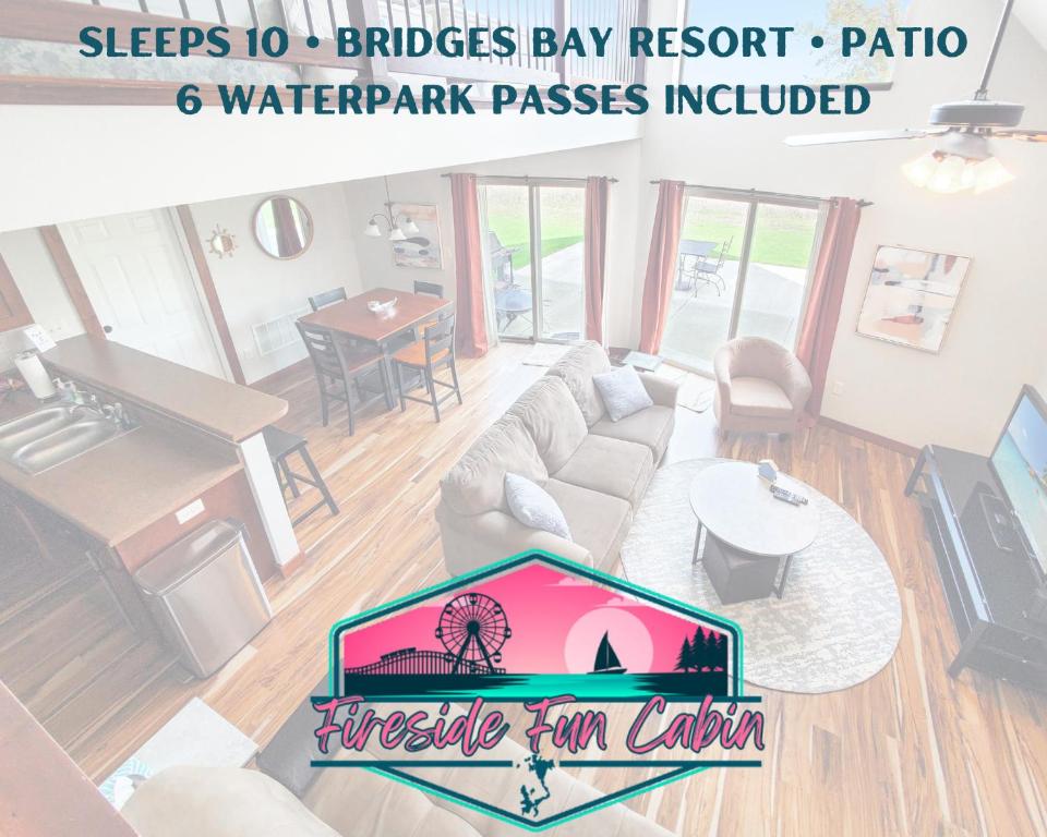 a living room with a couch and a table at Bridges Bay Vacation Cabin 33 in Arnolds Park