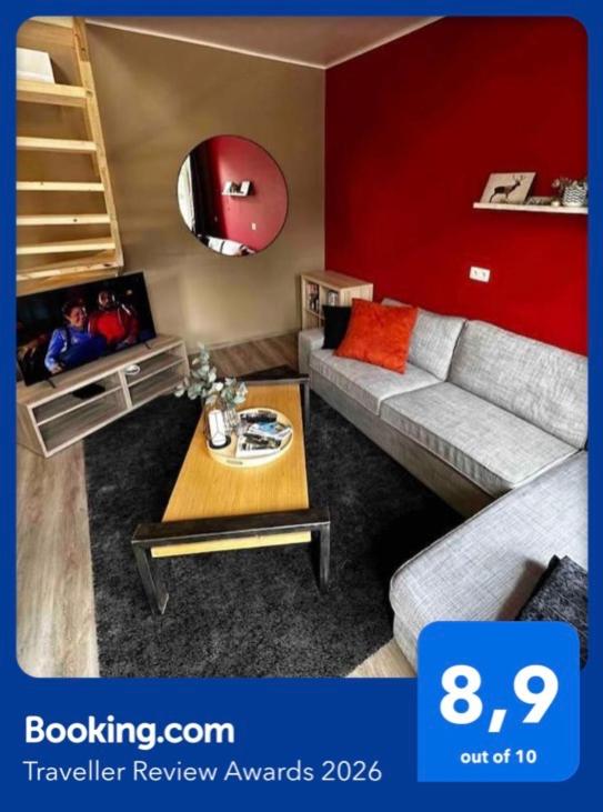 a living room with a couch and a table at Le Coin Rocheux in La-Roche-en-Ardenne