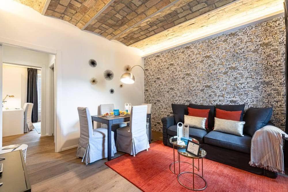 a living room with a couch and a table at Vaticano luxury sleep in Rome