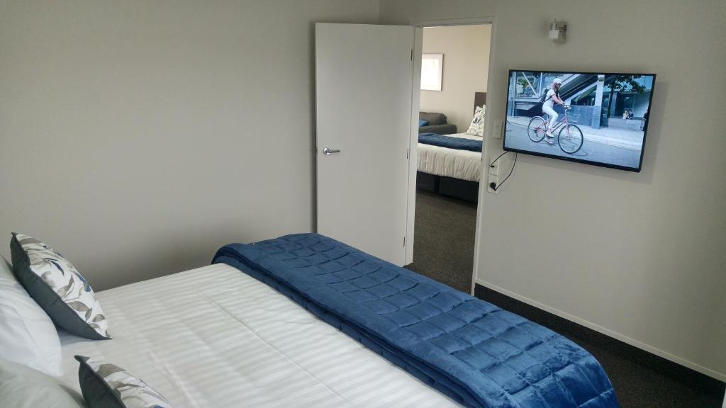 Postel nebo postele na pokoji v ubytování White Heron Motor Lodge