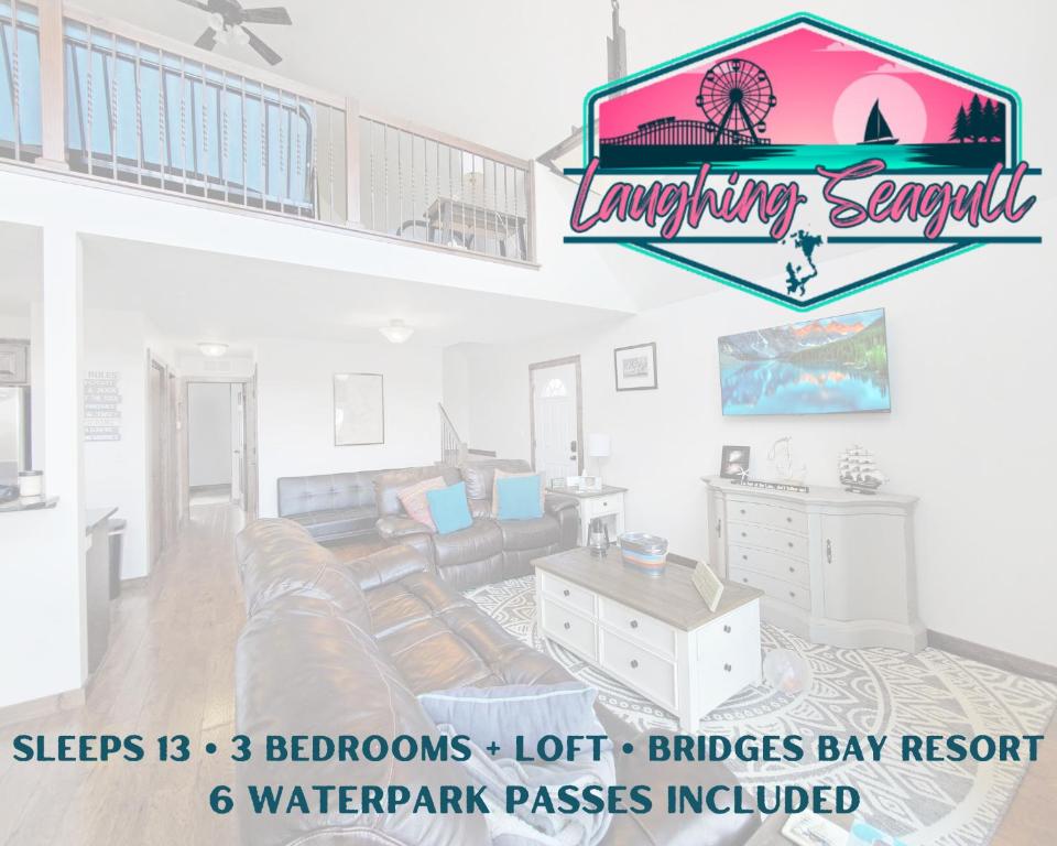 a living room with a couch and a table at Bridges Bay Vacation Cabin 115 in Arnolds Park