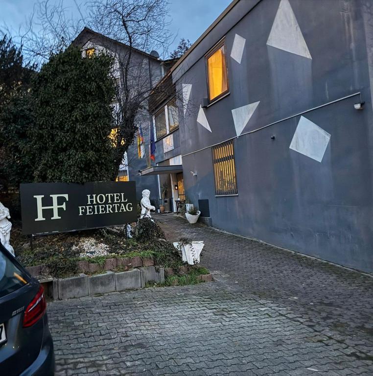 a building with a sign on the side of it at Hotel Feiertag in Pforzheim