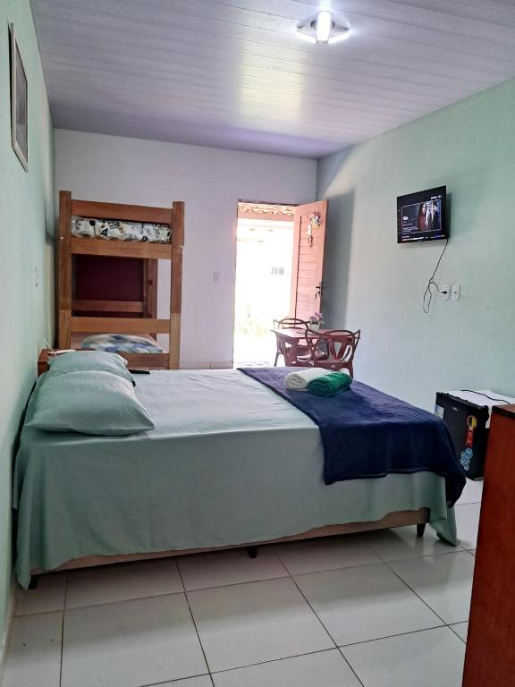 a bedroom with a large bed in a room at Aguapé quarto 3 in Barreirinhas