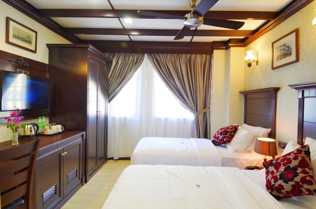 Postel nebo postele na pokoji v ubytování Hotel Kooler Inn