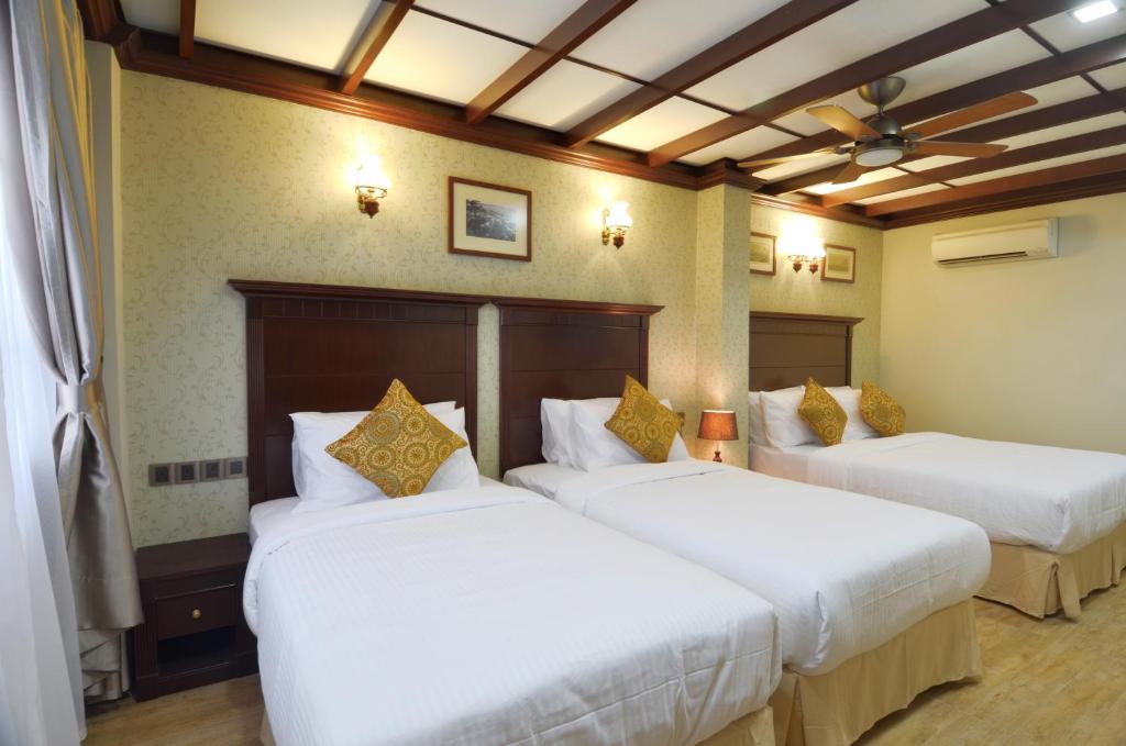 Postel nebo postele na pokoji v ubytování Hotel Kooler Inn