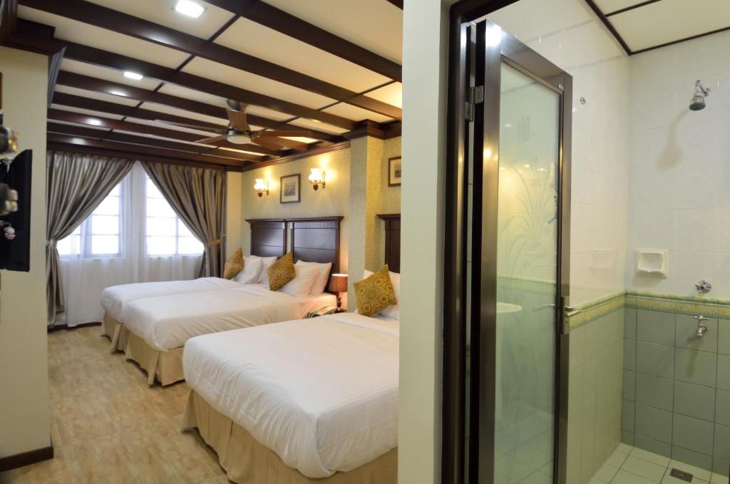 Postel nebo postele na pokoji v ubytování Hotel Kooler Inn