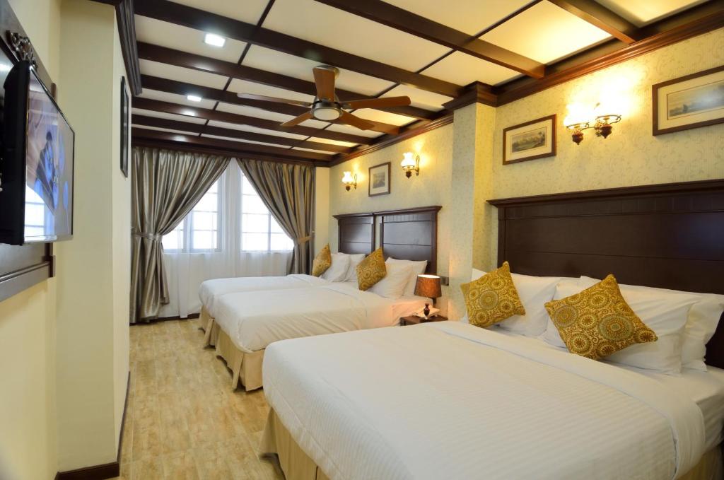 Postel nebo postele na pokoji v ubytování Hotel Kooler Inn