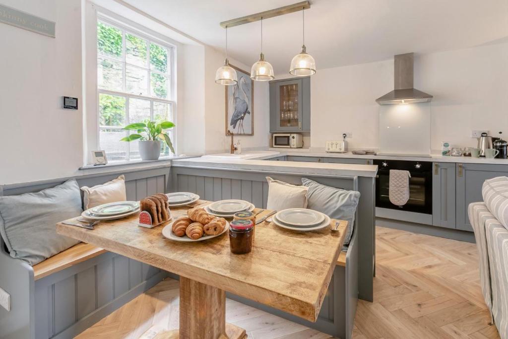a kitchen with a wooden table with food on it at 2 Bed in Fowey oc-m29077 in Fowey