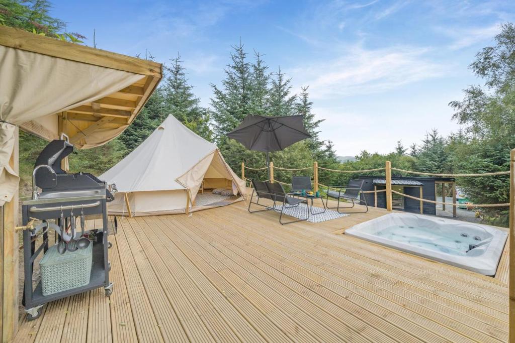 a deck with a tent and a hot tub at 1 Bed in Austwick oc-r32793 in Eldroth