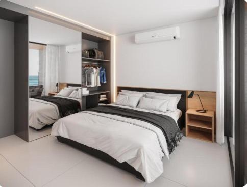 a bedroom with two beds in a room at Porto Life 2 Muro Alto in Tejucopapo