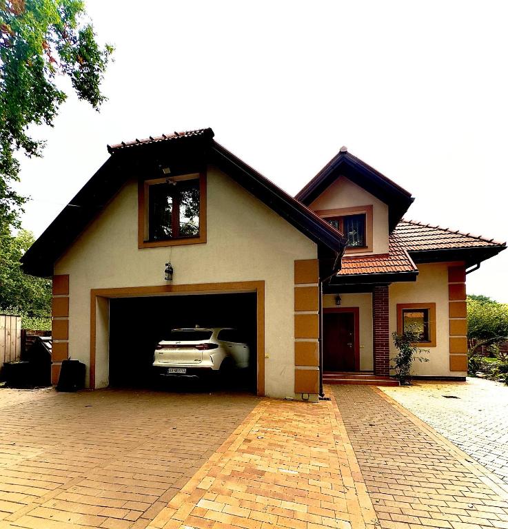 a car is parked inside of a garage at Villa Trypill in Tripolʼye