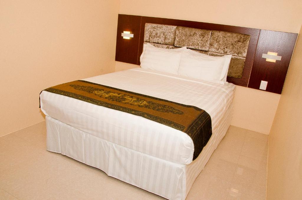 Postel nebo postele na pokoji v ubytování Grand Diamond Hotel Trinidad