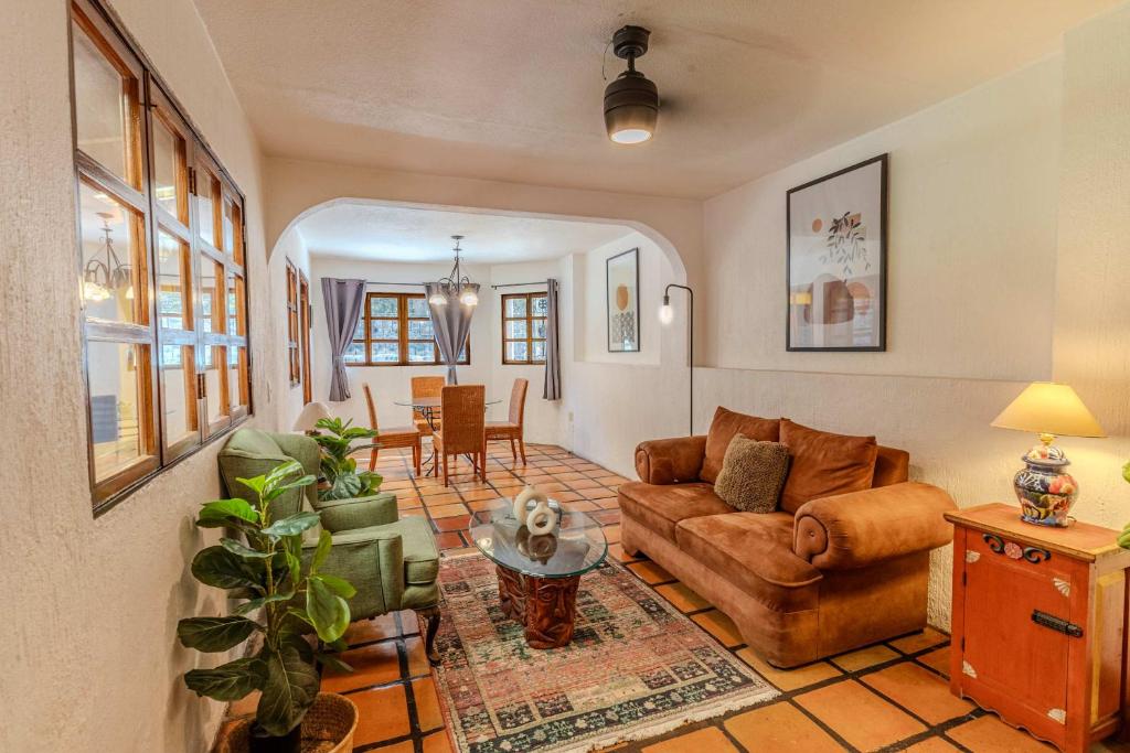 a living room with a couch and a table at Casa Hidalgo Hideaway in Chapala