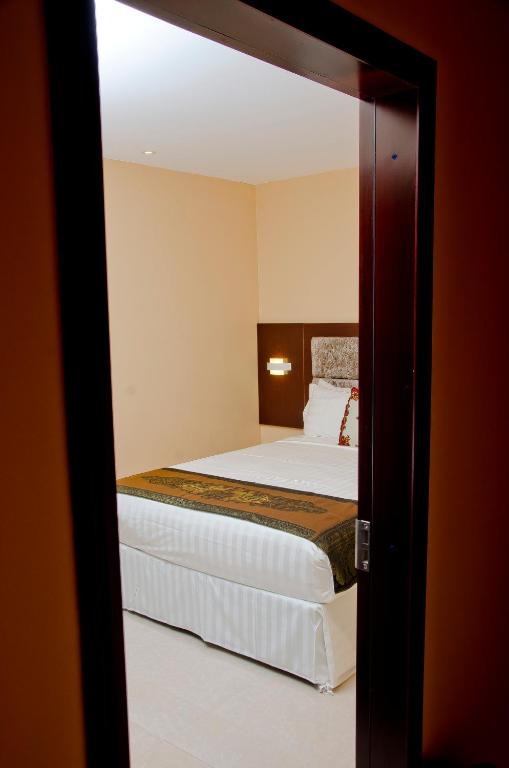 Postel nebo postele na pokoji v ubytování Grand Diamond Hotel Trinidad