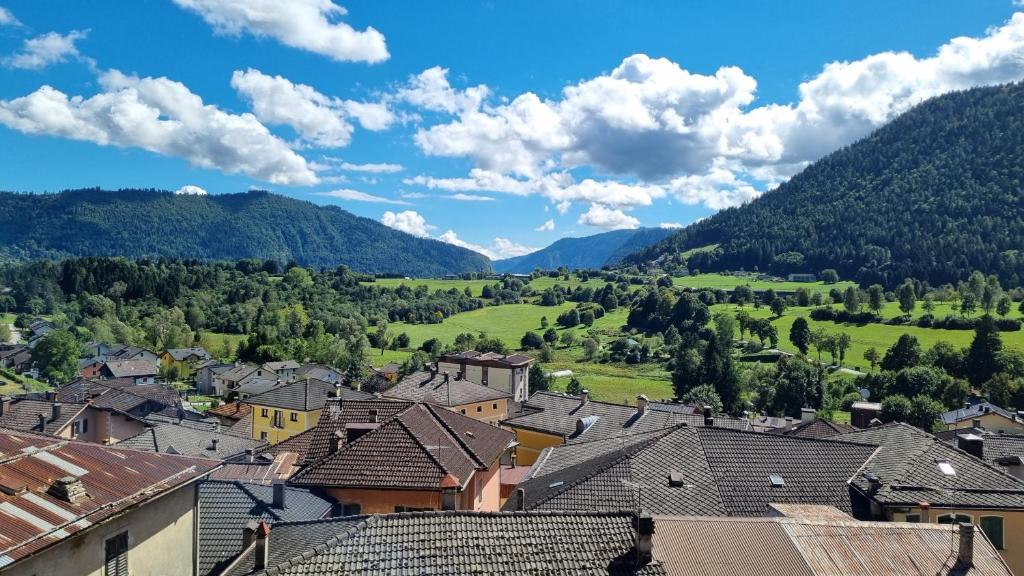 a town in a valley with mountains in the background at Casa Vacanze Tel 121 in Pieve Tesino