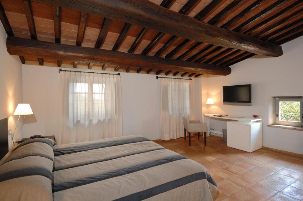 A bed or beds in a room at Locanda Della Picca