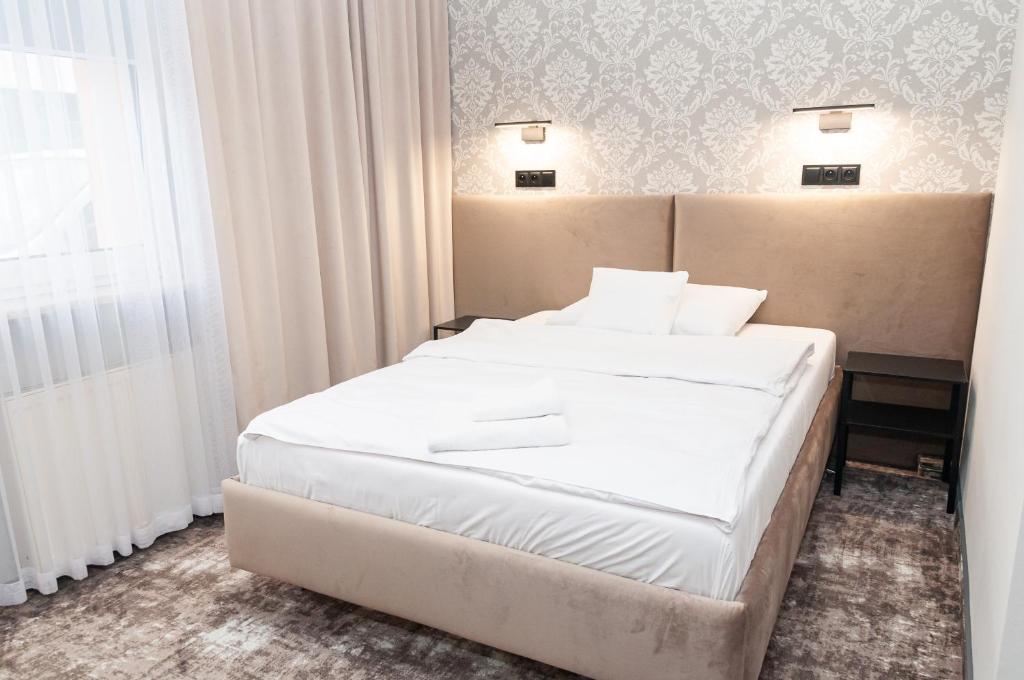 a hotel room with two beds and a window at Vistula Hotel in Świecie