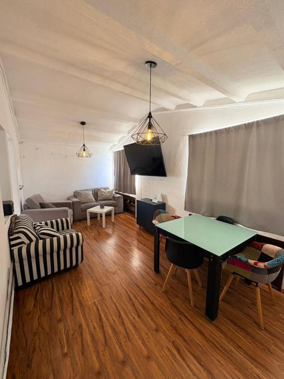 a living room with a couch and a table at Soul Home in Momoxpan
