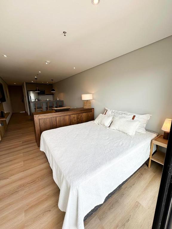 Tempat tidur dalam kamar di Edificio Garden Park