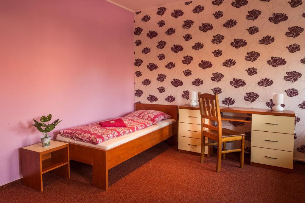 Postel nebo postele na pokoji v ubytování Penzion Na Kopečku