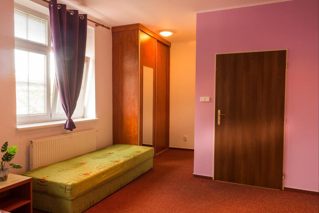 Postel nebo postele na pokoji v ubytování Penzion Na Kopečku
