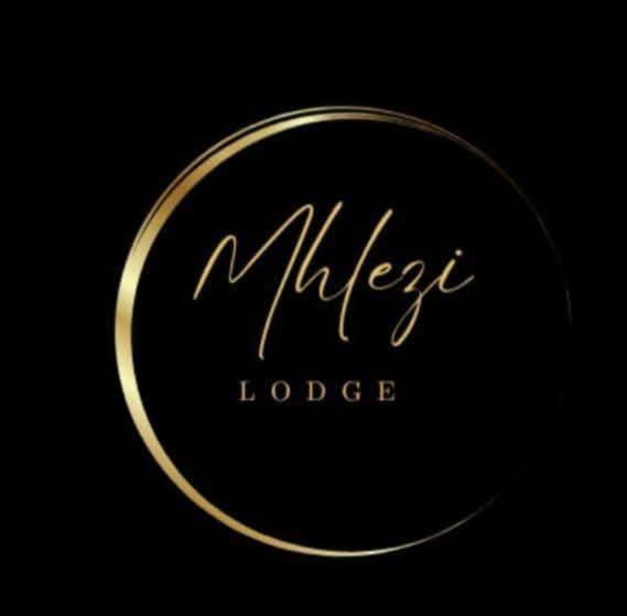 a close up of a gold logo on a black background at Mhlezi Lodge in Richards Bay