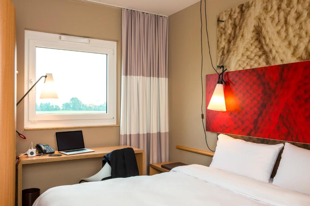 Postel nebo postele na pokoji v ubytování ibis Cambrai