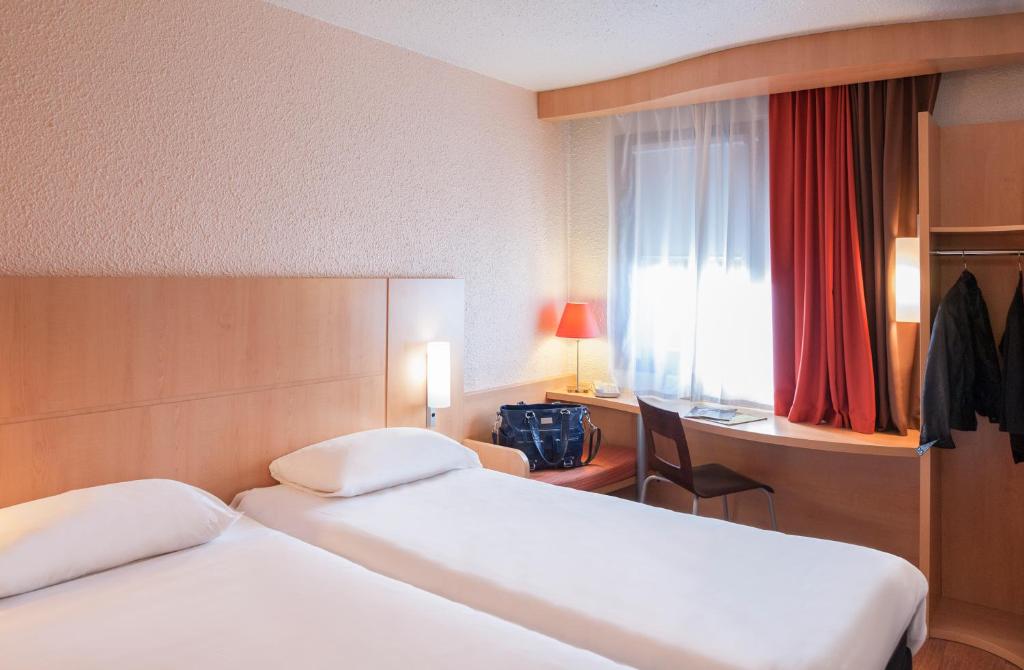 Postel nebo postele na pokoji v ubytování ibis Cambrai