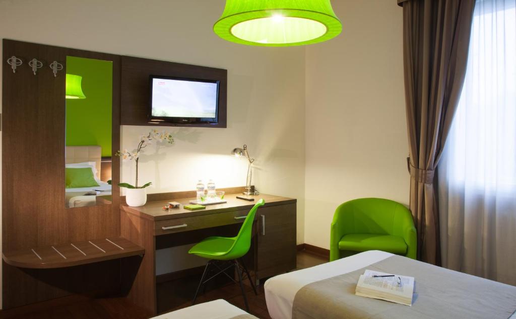 Postel nebo postele na pokoji v ubytování Hotel Milano Palmanova