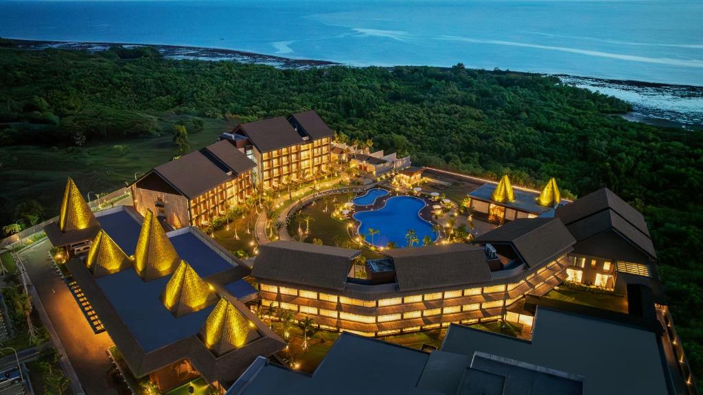 an aerial view of a resort with a pool at Myze Hotel Waingapu in Waingapu
