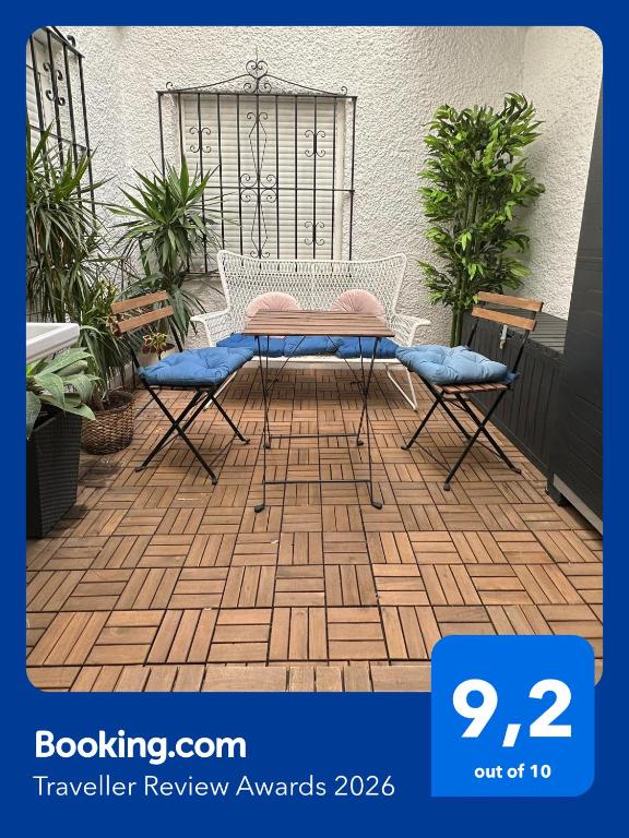 a table and two chairs on a patio at Spacious 3BR Walk to Beach & Old Town Marbella in Marbella