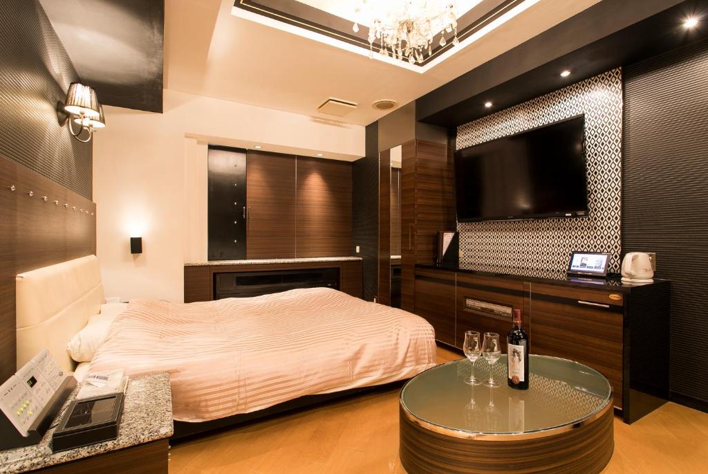 Postel nebo postele na pokoji v ubytování HOTEL PAL Otsuka -Adult Only-