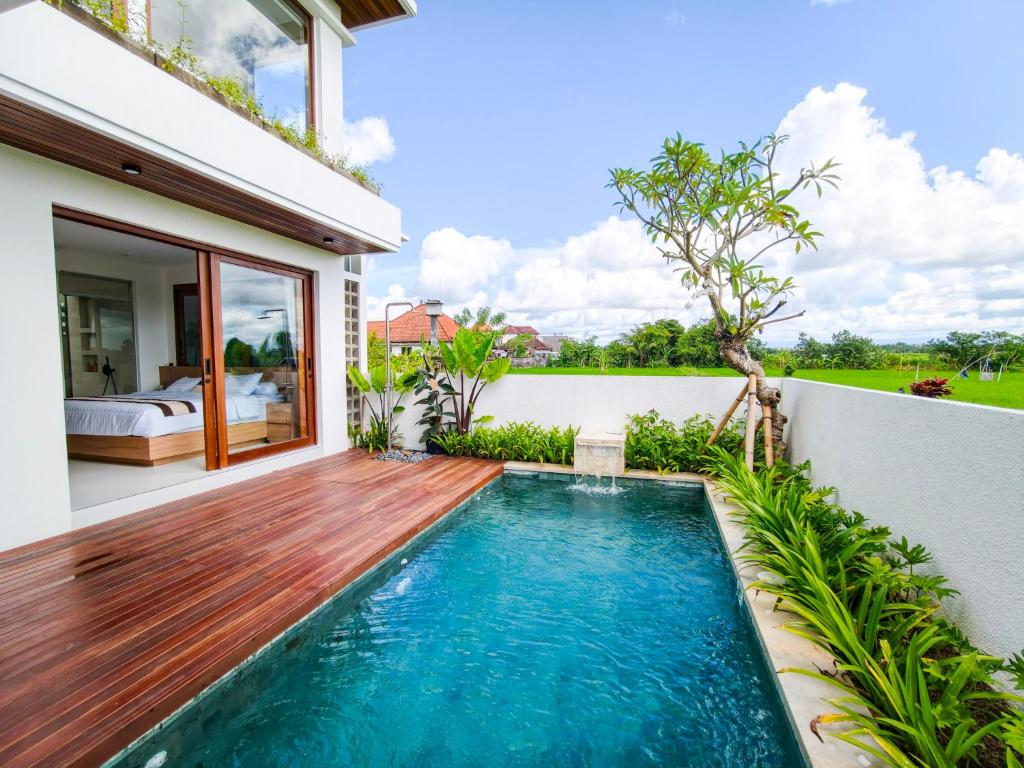 a swimming pool in the backyard of a villa at Mountain Sunshine Private Villa in Darmasaba